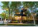 Charming two-story home boasting a blend of modern design and classic elegance, surrounded by mature trees and lush landscaping at 920 Neon Forest Cir, Longmont, CO 80504