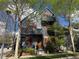 Charming modern home featuring an orange door, vibrant windows, and a multi-story design at 920 Neon Forest Cir, Longmont, CO 80504
