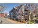 Contemporary home featuring unique exterior colors, multi-story construction, and landscaping at 920 Neon Forest Cir, Longmont, CO 80504
