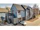 Home with a unique exterior design, including a detached garage and a view of the upper level deck at 920 Neon Forest Cir, Longmont, CO 80504