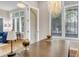 Sunlit home office with large windows, custom lighting, and a spacious desk perfect for remote work at 920 Neon Forest Cir, Longmont, CO 80504