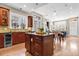 Open kitchen featuring an island with bar seating, modern appliances, and ample natural light at 920 Neon Forest Cir, Longmont, CO 80504