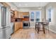 Cozy kitchen with stainless steel appliances, maple cabinets, and a counter bar with chairs at 920 Neon Forest Cir, Longmont, CO 80504