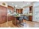 Modern kitchen featuring stainless steel appliances, a functional island, and stylish bar seating at 920 Neon Forest Cir, Longmont, CO 80504