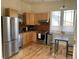 Kitchen features stainless steel appliances, light wood cabinetry and flooring, plus natural light at 920 Neon Forest Cir, Longmont, CO 80504