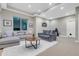 Cozy living room with plush seating, recessed lighting, and a large window for natural light at 920 Neon Forest Cir, Longmont, CO 80504
