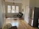 Bright living room featuring hardwood floors, seating and windows offering neighborhood views at 920 Neon Forest Cir, Longmont, CO 80504