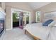 Main bedroom has a fireplace and an open french door leading to a private balcony with serene views at 920 Neon Forest Cir, Longmont, CO 80504