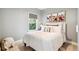 Charming bedroom featuring soft colors, bright windows, and a cozy bed for a tranquil and relaxing experience at 3625 W 9Th Ave, Denver, CO 80204