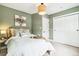 Comfortable bedroom with a full bed, unique lighting, and a large closet with ample storage space at 3625 W 9Th Ave, Denver, CO 80204