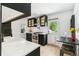 Stylish kitchen features stainless steel appliances, white countertops, a farmhouse sink, and a cozy dining area at 3625 W 9Th Ave, Denver, CO 80204