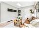 Cozy living room with skylight, comfortable sofa, and access to other rooms at 3625 W 9Th Ave, Denver, CO 80204