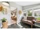 Cozy sunroom with ample natural light, tiled floors, and comfortable seating at 3625 W 9Th Ave, Denver, CO 80204