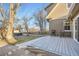 Backyard view with raised deck, outdoor seating, hot tub and manicured landscaping at 4385 Carr St, Wheat Ridge, CO 80033