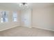 Bright bedroom featuring carpeted floor, light fixture and white trim throughout at 4385 Carr St, Wheat Ridge, CO 80033