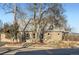 Home exterior featuring brick and tan paint with grey roof at 4385 Carr St, Wheat Ridge, CO 80033