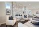 Bright living room featuring a modern fireplace and seating area with stylish decor and plenty of natural light at 4385 Carr St, Wheat Ridge, CO 80033