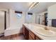 Bathroom features a double sink vanity and a tub with a shower at 5455 W 112Th Pl, Westminster, CO 80020
