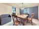Cozy dining room with wooden table, bench seating, and a view of the kitchen at 5455 W 112Th Pl, Westminster, CO 80020