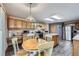 Spacious kitchen and dining area boasts lots of cabinet space and stainless steel appliances at 5455 W 112Th Pl, Westminster, CO 80020