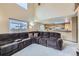 Comfortable living room with an extra-large sectional sofa near the kitchen and dining area at 5455 W 112Th Pl, Westminster, CO 80020
