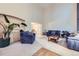 Bright and spacious living room featuring high ceilings, plush seating, and neutral carpeting at 5455 W 112Th Pl, Westminster, CO 80020