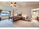 Main bedroom features a ceiling fan, a vaulted ceiling, and large window at 5455 W 112Th Pl, Westminster, CO 80020