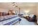 Comfortable main bedroom featuring a ceiling fan, a four-poster bed, and soft carpet at 5455 W 112Th Pl, Westminster, CO 80020