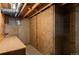Unfinished basement with exposed beams, storage, and possible workshop space at 653 S Main St, Elizabeth, CO 80107