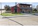 Charming commercial building with outdoor seating and large windows providing ample natural light at 653 S Main St, Elizabeth, CO 80107