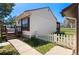 Side view of a cozy home with a well-maintained lawn and walkway at 653 S Main St, Elizabeth, CO 80107