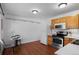 Efficient kitchen and dining area with natural light and wood accents at 653 S Main St, Elizabeth, CO 80107