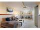 Basement living room with plush sofa, coffee table, accent chairs, and three wall art pieces at 653 S Main St, Elizabeth, CO 80107