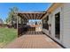 Wooden patio area with decorative pergola, perfect for outdoor living and entertaining at 653 S Main St, Elizabeth, CO 80107