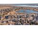 Aerial view showcasing neighborhood and lake at 9821 S Flower Ct, Littleton, CO 80127