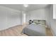 Comfortable bedroom with natural light, closet, and hardwood floors at 1552 W Caley Ave, Littleton, CO 80120