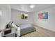 Cozy bedroom featuring hardwood floors and natural light at 1552 W Caley Ave, Littleton, CO 80120
