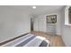 Bright bedroom featuring hardwood floors, natural light, and closet space at 1552 W Caley Ave, Littleton, CO 80120