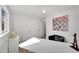 Bright office space with large window, white walls, closet, and a fun London-themed graphic art print at 1552 W Caley Ave, Littleton, CO 80120
