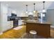 Modern kitchen with island and stainless steel appliances at 14000 E Linvale Pl # 110, Aurora, CO 80014