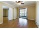 Bright living room with hardwood floors and access to balcony at 14000 E Linvale Pl # 110, Aurora, CO 80014