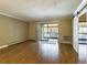 Spacious living room with hardwood floors and sliding door to balcony at 14000 E Linvale Pl # 110, Aurora, CO 80014