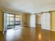 Living room with hardwood floors and barn doors at 14000 E Linvale Pl # 110, Aurora, CO 80014