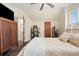 A bedroom with a ceiling fan, a closet, and a neutral color scheme at 3337 Decatur St, Denver, CO 80211