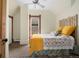 This bedroom has a decorative headboard, ceiling fan, and large window at 3337 Decatur St, Denver, CO 80211