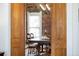 Charming dining room featuring exposed brick wall, elegant lighting, and a spacious table, perfect for gatherings at 3337 Decatur St, Denver, CO 80211