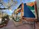Outdoor seating and a mural enhance the facade of this business space at 3337 Decatur St, Denver, CO 80211