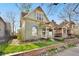 Charming two-story home with a quaint front porch, colorful vintage paint, and lovely landscaping at 3337 Decatur St, Denver, CO 80211