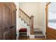 Inviting foyer with a staircase, wood accents, and natural light, creating a warm and welcoming entrance to the home at 3337 Decatur St, Denver, CO 80211
