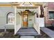 Cozy front porch with intricate railing and design, inviting you to relax and enjoy the outdoor space of this charming home at 3337 Decatur St, Denver, CO 80211